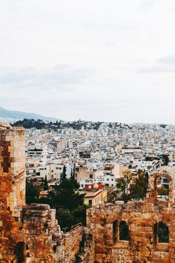 Photo taken from the Acropolis in Athens, Greece. The view overlooks the rooftops of the capital, which are predominantly white in colour.