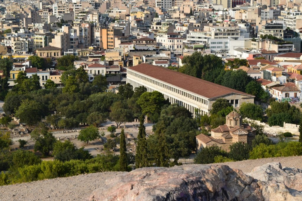 Photo taken from the Acropolis in Athens, Greece. You can see the ruins next to the acropolis and the houses of the Greek capital in the background.